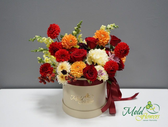 Box with red roses, dahlias, and eustoma photo